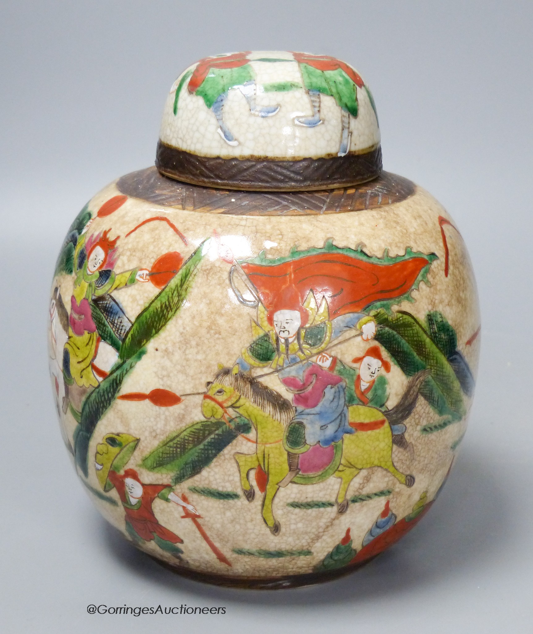 An early 20th century Chinese famille rose crackle glaze jar and cover, 20cm high